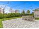 Backyard patio with string lights and dining table at 6205 Voyagers Pl, Apollo Beach, FL 33572