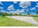 Beach volleyball court with surrounding grass at 6205 Voyagers Pl, Apollo Beach, FL 33572