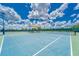 Well-maintained tennis courts with shade structures at 6205 Voyagers Pl, Apollo Beach, FL 33572