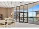 Bright community room with tables, chairs, and stunning water views at 6265 Sun Blvd # 906, St Petersburg, FL 33715