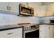 Kitchen with stainless steel appliances and granite countertops at 6265 Sun Blvd # 906, St Petersburg, FL 33715