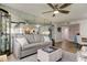 Bright and airy living room with mirrored wall maximizing the natural light at 6265 Sun Blvd # 906, St Petersburg, FL 33715