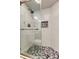 Walk-in shower with hexagon tile floor and glass enclosure at 6265 Sun Blvd # 906, St Petersburg, FL 33715