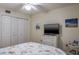 Bedroom with double bed, TV, dresser, and large closet at 6432 Remus Dr, New Port Richey, FL 34653