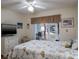 Bedroom with a ceiling fan and access to a screened lanai at 6432 Remus Dr, New Port Richey, FL 34653