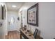 Bright entryway with wood floors and decorative console table at 6432 Remus Dr, New Port Richey, FL 34653