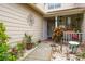 Front entry with lush landscaping and walkway to covered porch at 6432 Remus Dr, New Port Richey, FL 34653