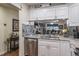 Modern kitchen with white cabinets and granite countertops at 6432 Remus Dr, New Port Richey, FL 34653