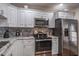 Modern kitchen with stainless steel appliances and granite countertops at 6432 Remus Dr, New Port Richey, FL 34653