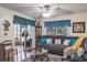 Cozy living room featuring a sectional sofa, coffee table, and sliding glass doors leading to a patio at 6432 Remus Dr, New Port Richey, FL 34653