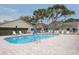 Community pool with plenty of lounge chairs at 6432 Remus Dr, New Port Richey, FL 34653