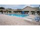 Clean community pool with surrounding lounge chairs at 6432 Remus Dr, New Port Richey, FL 34653