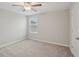 Cozy bedroom featuring neutral decor and carpet flooring at 656 Argyll Dr, Spring Hill, FL 34609