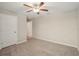 Well-lit bedroom with carpet flooring and neutral wall colors at 656 Argyll Dr, Spring Hill, FL 34609