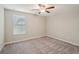 Charming bedroom with carpet flooring and a window with blinds at 656 Argyll Dr, Spring Hill, FL 34609