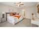 Spacious bedroom with plush bed, side tables and an ensuite bathroom at 656 Argyll Dr, Spring Hill, FL 34609