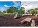 Community playground with playset and picnic table at 656 Argyll Dr, Spring Hill, FL 34609