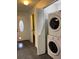 View of the entryway with a washer and dryer to the right of the entry door at 7806 Amberlea Ct, Temple Terrace, FL 33637