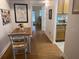 Dining area with wood floor and view into kitchen at 8101 113Th Street St # 107, Seminole, FL 33772