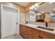 Bathroom with double vanity, copper sinks, and tiled walls at 830 23Rd N Ave, St Petersburg, FL 33704