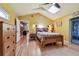 Bedroom with vaulted ceiling, hardwood floors and a wooden bed frame at 830 23Rd N Ave, St Petersburg, FL 33704