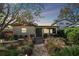 House exterior at dusk featuring a landscaped walkway at 830 23Rd N Ave, St Petersburg, FL 33704