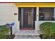 Inviting front entrance with a red door and brick steps at 830 23Rd N Ave, St Petersburg, FL 33704