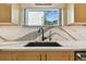 Modern kitchen sink with black faucet and stunning quartz countertop at 830 23Rd N Ave, St Petersburg, FL 33704