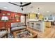 Open concept kitchen with yellow cabinets and marble countertops at 830 23Rd N Ave, St Petersburg, FL 33704