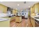 Modern kitchen with yellow cabinets and marble countertops at 830 23Rd N Ave, St Petersburg, FL 33704