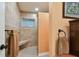 Walk-in shower with tiled walls and built-in seat at 830 23Rd N Ave, St Petersburg, FL 33704