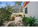 Landscaped side yard with gravel pathway and raised garden beds at 830 23Rd N Ave, St Petersburg, FL 33704