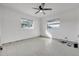 Simple bedroom with terrazzo floors and ceiling fan at 960 43Rd Ne Ave, St Petersburg, FL 33703