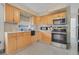 Updated kitchen featuring light wood cabinets and stainless steel appliances at 960 43Rd Ne Ave, St Petersburg, FL 33703