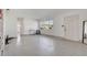 Bright living room featuring a large window and terrazzo floors at 960 43Rd Ne Ave, St Petersburg, FL 33703