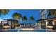 Luxury pool deck with fire pit, lounge chairs, and city views at 1101 E Jackson St # 3601, Tampa, FL 33602