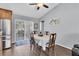 Bright dining room with wood floors and sliding glass doors leading to the outside at 10448 Utah St, Spring Hill, FL 34608