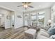 Living room with hardwood floors, comfy seating, and a view of the bedroom and bathroom at 108 13Th Ave, Indian Rocks Beach, FL 33785