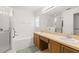 Clean bathroom, featuring double vanity, shower, and bathtub at 10833 Collar Dr, San Antonio, FL 33576