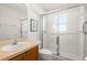 Clean bathroom with a walk-in shower and updated vanity at 10833 Collar Dr, San Antonio, FL 33576