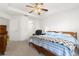 Bright bedroom with a double bed, ceiling fan, and ample closet space at 10833 Collar Dr, San Antonio, FL 33576
