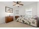 Bedroom with a daybed, dresser, ceiling fan, and window at 10833 Collar Dr, San Antonio, FL 33576