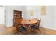Bright dining room features a wood table with chairs and a hutch at 10833 Collar Dr, San Antonio, FL 33576