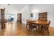 Spacious dining area with hardwood floors and view into living room at 10833 Collar Dr, San Antonio, FL 33576
