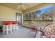 Relaxing screened porch with outdoor seating and backyard access at 10833 Collar Dr, San Antonio, FL 33576