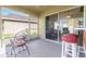 Screened porch with seating, a wet bar, and tranquil views at 10833 Collar Dr, San Antonio, FL 33576