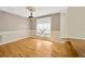 Bright dining room with hardwood floors and large window at 1103 Wild Citrus Ln, Sarasota, FL 34240