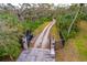 Gated entrance with long driveway leading to home at 1103 Wild Citrus Ln, Sarasota, FL 34240