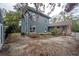 Rear view of a two-story home with a patio at 1211 E Clifton St, Tampa, FL 33604