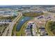 Aerial view of a community with lakes and houses at 12143 Kingsley Trl, Parrish, FL 34219